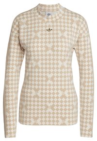 Dlouhý rukáv top v béžové a krémové kostkované vzoru se subtilními květinovými akcenty. Obsahuje límec a vyšívané logo.