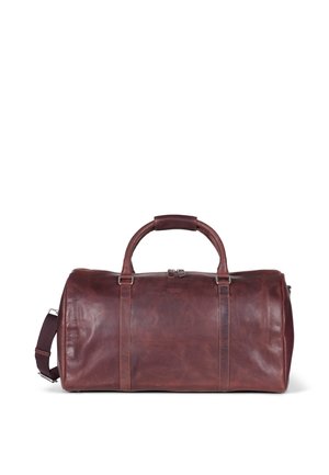 Borsa da viaggio cilindrica in pelle marrone, con manici superiori e tracolla staccabile. Presenta una texture liscia e hardware minimale.
