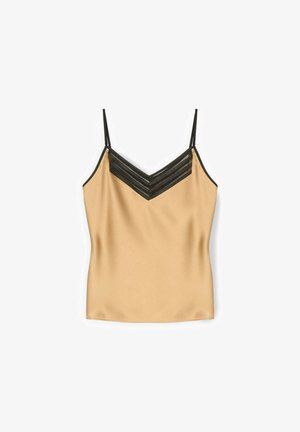 Beżowa satynowa koszulka na cienkich czarnych ramiączkach z dekoltem w kształcie litery V ozdobiona czarnymi poziomymi paskami z siateczki.