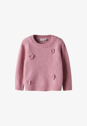 Roze gebreide trui met een ronde halslijn, geribde mouwen en onderkant, en driedimensionale bloemenversieringen aan de voorkant.