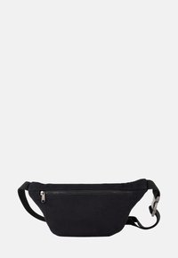 Black canvas fanny pack with a zip closure, adjustable strap, and a smooth texture. Features a minimalist design and a rounded shape.