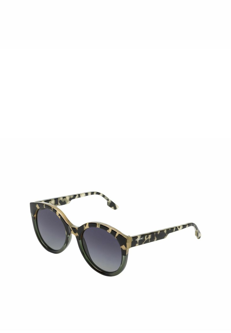 Lunettes de soleil rondes avec une monture à motifs noir et vert, des verres dégradés gris foncé et de subtils accents dorés sur la ligne des sourcils.