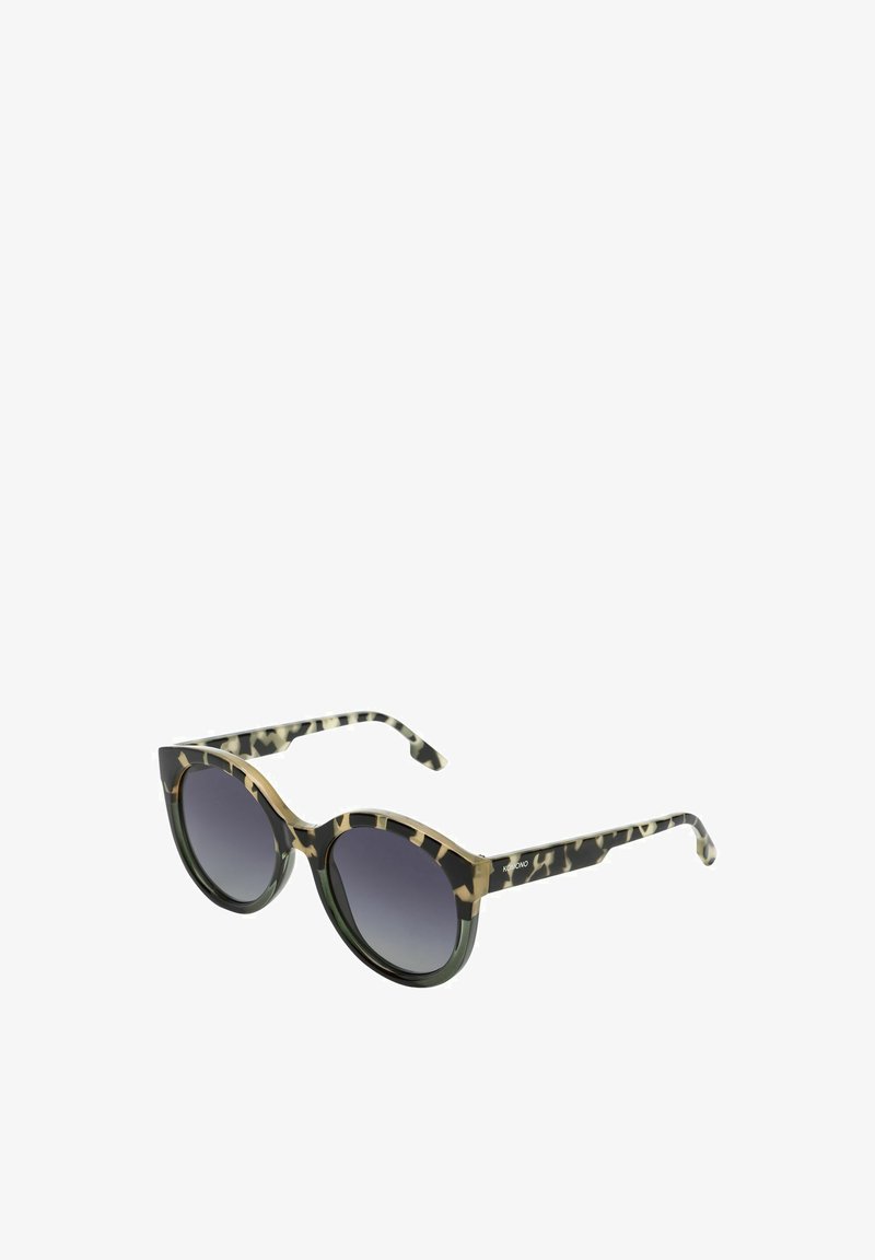 Lunettes de soleil rondes avec une monture à motifs noir et vert, des verres dégradés gris foncé et de subtils accents dorés sur la ligne des sourcils.