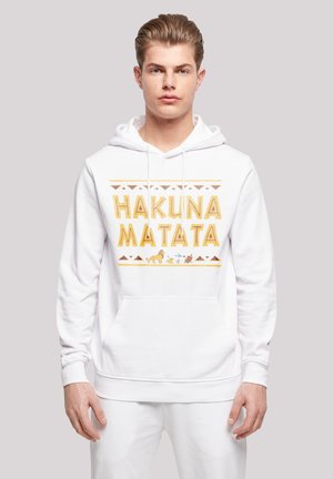 White hooded sweatshirt featuring "HAKUNA MATATA" in yellow and brown, with animal icons and geometric patterns on the front.