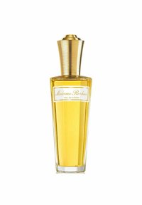 Kirkas lasipullo, kapeutuva muoto, täytetty keltaisella tuoksulla. Pullossa on uritettu kultainen kansi ja valkoinen etiketti mustalla tekstillä.