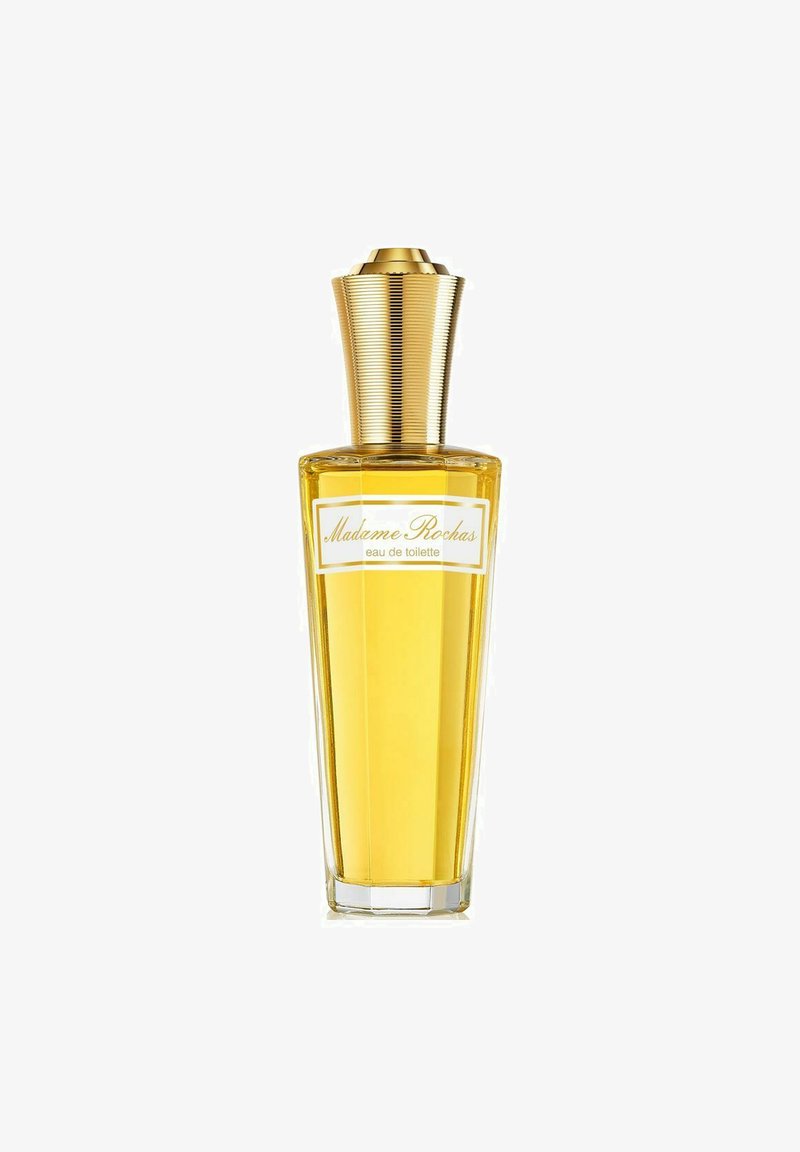 Kirkas lasipullo, kapeutuva muoto, täytetty keltaisella tuoksulla. Pullossa on uritettu kultainen kansi ja valkoinen etiketti mustalla tekstillä.