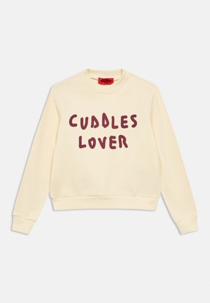 Langärmeliges Sweatshirt in Cremeton mit bordeauxrotem Schriftzug „CUDDLES LOVER“ mittig auf der Vorderseite, Rundhalsausschnitt und gerippten Bündchen.