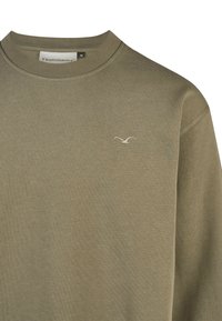 Olivgrüner Pullover mit rundem Ausschnitt und gerippten Bündchen. Mit einem kleinen, weißen gestickten Vogel-Logo auf der linken Brust. Weiches Material.