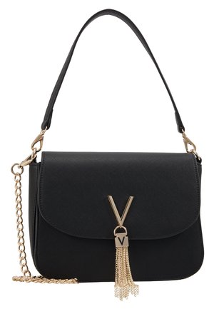 Black handbag with a gold "V" clasp and tassel, featuring both a short leather handle and a detachable gold chain strap.