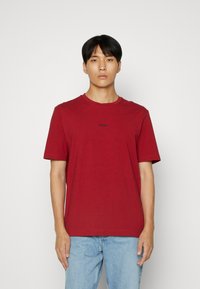 BOSS TCHUP - T-shirts - red four