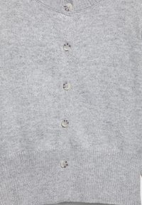 Light gray knitted cardigan with five round marbled buttons down the front and ribbed hem.