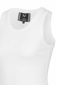 Witte mouwloze top van ribstof katoen, met een ronde halslijn, subtiele logo aan de voorkant en label met maat S.