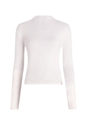 Haut à manches longues blanc en matériau doux, avec un col rond, une coupe ajustée et un design minimaliste sans motifs ni embellissements.