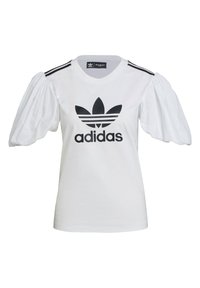 Camiseta de algodón blanca con mangas abullonadas, el logo negro de Adidas y tres rayas negras en los hombros. Textura suave y ajuste casual.