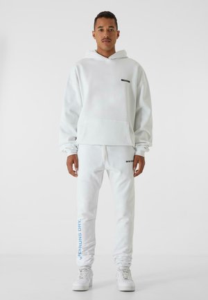 LEG PRINT - Pantaloni sportivi - white