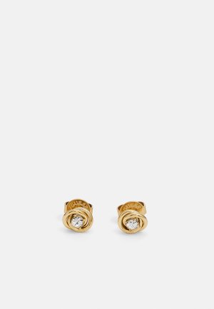 Gold-tone stud earrings featuring a spiraled design with a clear, circular rhinestone at the center. Smooth texture with engraved branding.