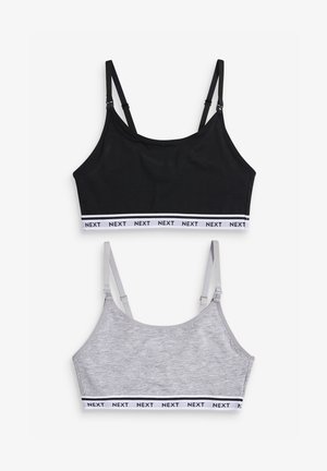 Zwarte en grijze crop tops met verstelbare bandjes en contrasterende elastische banden met het "NEXT"-logo. Zachte stof met een gladde textuur.
