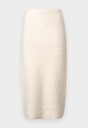 Knee-pikkune kremi seelik, mis on valmistatud tekstuursest kangast. Sellel on vormistatud lõige, sile vöökoht ja nähtamatud kinnitused puuduvad.