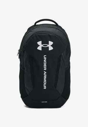 Black backpack made of durable fabric featuring a front logo, side mesh pockets, and a padded back for comfort.