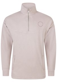 Světlý béžový pulovr s polovičním zipem u límce, měkkou texturou, dlouhými rukávy a bočními kapsami. Na hrudi je kruhový nápis "YOUNG POETS".