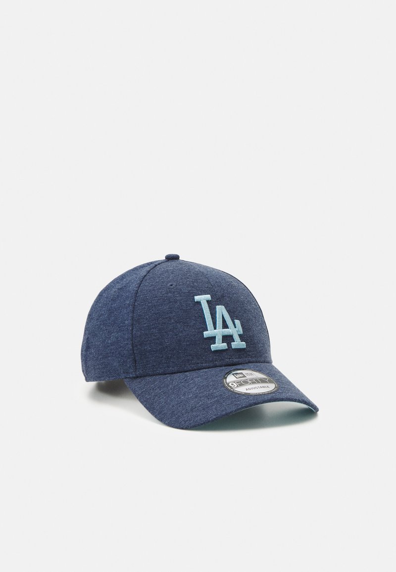 Navy blue cap made of textured fabric featuring a light blue "LA" logo and a curved visor; includes a branded circular tag on the front.