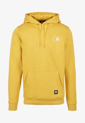 Žlutá mikina s kapucí vyrobená z měkké tkaniny, s klokaní kapsou, šňůrkovou kapucí a bílým logem na hrudi. Žebrované manžety a spodní lem.