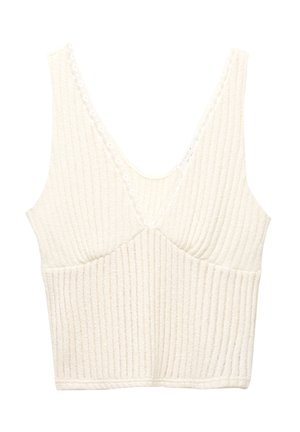 Crop top blanc à côtes avec un décolleté en V plongeant, bordure en dentelle et coutures de bonnets structurées pour la forme. Le tissu texturé ajoute de l'intérêt visuel.