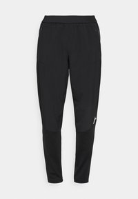 Pantalones deportivos negros con un diseño ajustado, cinturilla elástica, dos bolsillos laterales con cremallera y paneles de tela contrastante en las rodillas.