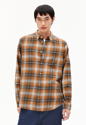 Long-sleeve plaid shirt in shades of orange, black, and gray. Features a button-down collar and single chest pocket. Soft, lightweight fabric.