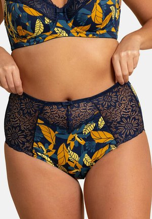 Culotte taille haute bleu marine ornée d'un motif floral jaune et vert, avec une superposition en dentelle et un petit nœud à l'avant.