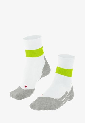 Calzini sportivi bianchi con una fascia verde brillante e sezioni grigie per la punta e il tallone, caratterizzati da una texture a motivo e un design alla caviglia.