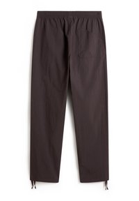 Dark gray lightweight pants with an elastic waistband, a single back pocket, and adjustable ankle ties. Smooth, textured fabric.