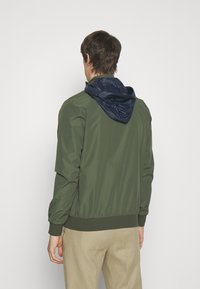 Hackett Aston Martin Racing Giacca a vento - olive