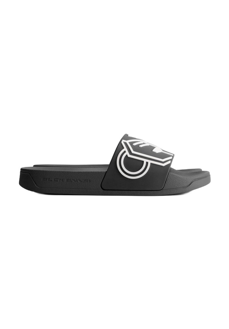 Black slide sandal with a soft synthetic strap featuring a white graphic design. Textured footbed and a solid black sole.