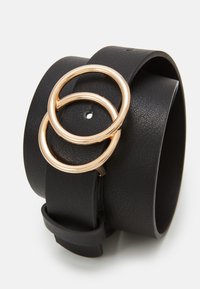 Black leather cuff bracelet featuring two interlocking gold rings as a centerpiece. Smooth texture with a matte finish and adjustable strap.
