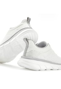 White athletic shoes featuring a textured mesh upper, elastic accents, and a cushioned, wave-patterned sole with a gray trim.