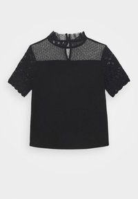 Haut noir à manches courtes avec manches en dentelle et empiècement en mesh à pois transparent, avec un col rond et une petite ouverture en forme de trou de serrure à l'avant.