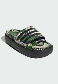 Slide sandal with a patterned green and black upper, featuring three black stripe details. Textured sole for grip and comfort.