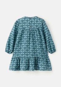 Floral print dress in teal with long balloon sleeves, gathered waist, and ruffled hem. Features fabric buttons at the back.
