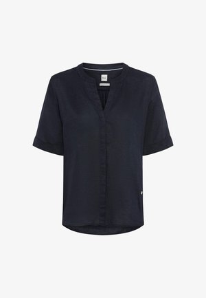 Blouse courte bleu marine à manches courtes avec encolure ronde, petite découpe en V, manches retroussées et détails discrets de couture devant.