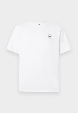 White cotton t-shirt with short sleeves, round neckline, and small circular logo featuring a star and text on the left chest area.
