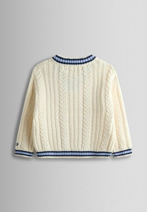 Kreemjas kaabelkootud kampsun ümara kaelusega, millel on tumesiniste ja valgete triipudega soonikkoes krae ja mansetid, tekstuuris punutud mustrid.