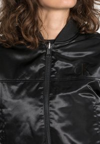 Calvin Klein Jeans REVERSIBLE - Blusão aviador - black
