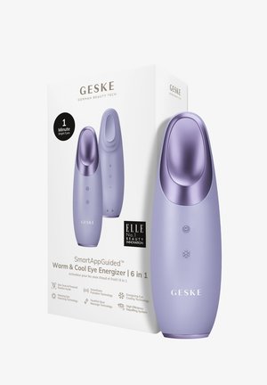 Varm og kølig øjenenergizer-enhed i blød lavendel med en glat finish, der har kontroller til varme- og køleindstillinger, vist med emballage.