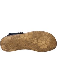 Suola di scarpa in gomma marrone con un motivo floreale, caratterizzata da fiori in rilievo e texture dettagliate. Forma arrotondata con superficie antiscivolo.