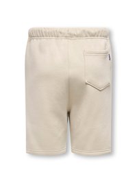 Beige bomulds shorts med elastisk talje og en baglomme. Glat tekstur med syet detaljer og et minimalistisk design.