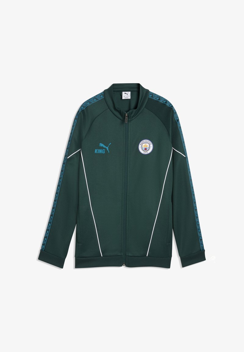 Veste zippée intégrale vert foncé avec logo Puma bleu, texte "KING", emblème de Manchester City et rayures bleues à motifs le long des manches.