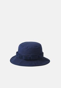 Navy blue bucket hat made of fabric, featuring a sturdy brim and a textured band around the crown for added detail.
