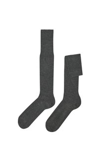 Šedé podkolenky vyrobené z měkké, strukturované tkaniny. Mají vroubkovaný lem a hladký vnitřek. Jednoduchý design bez vzorů.