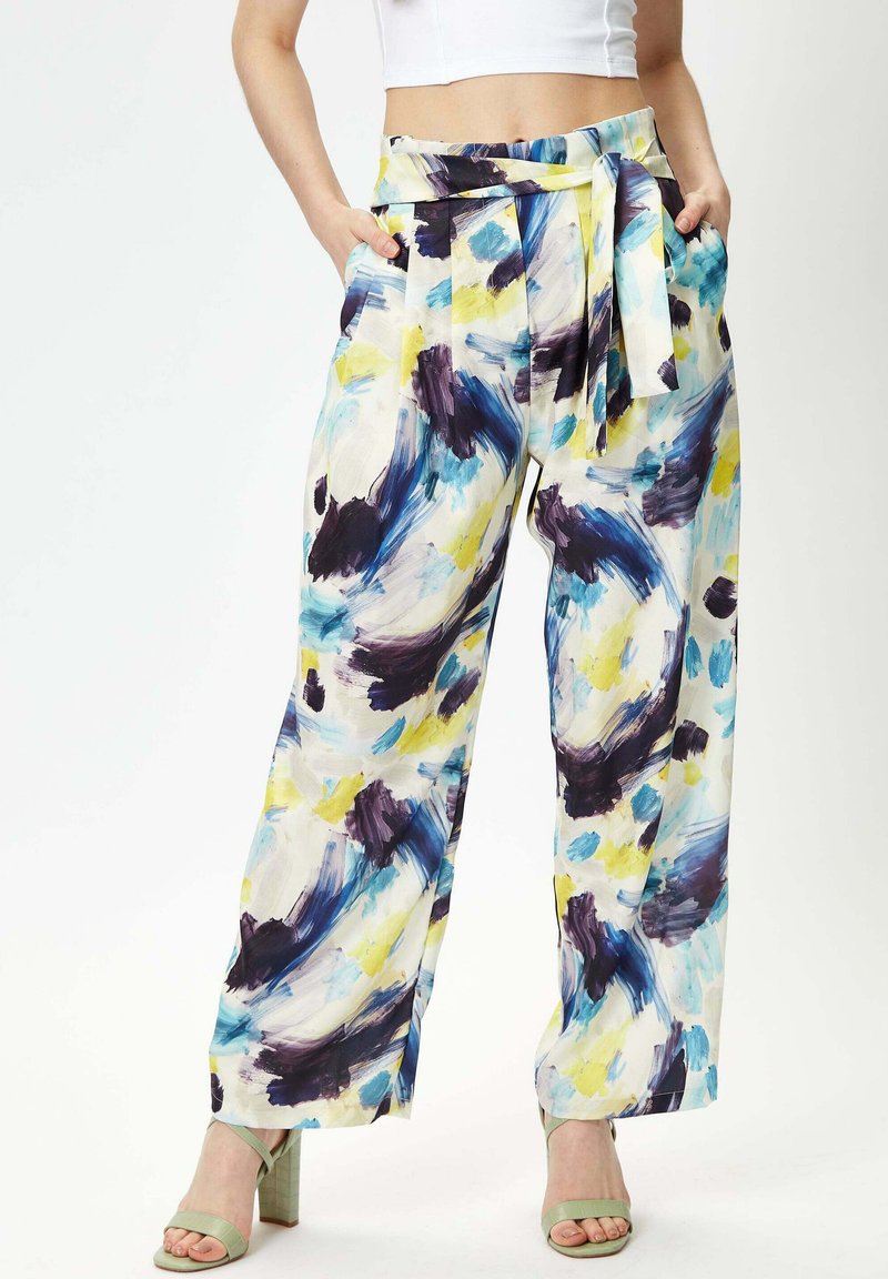 Wide-leg pants featuring a watercolor abstract pattern in blue, purple, and yellow. Made from lightweight fabric with a tie belt and pockets.